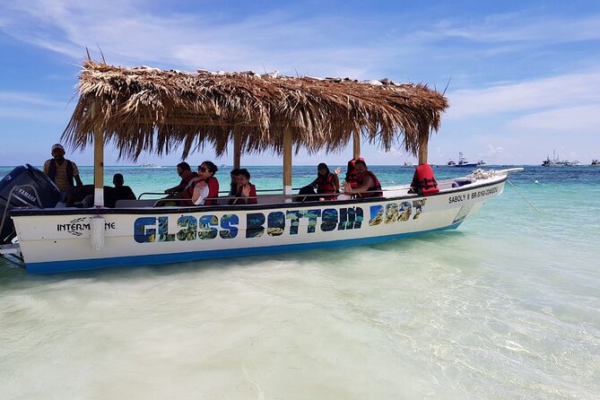 2-Hour Glass Bottom Boat Experience in Punta Cana - Palmilla Natural Pool: shallow water, coral terrace, and a long-ish walk