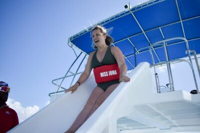 Experience for families and friends by private boat with pick-up - Stop 3: the natural pool party in the sea (slides, music, and snacks)