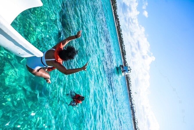 Party boat in Catamaran with Open Bar adults only - Stop 1: Coral reef snorkeling at Punta Cana (about 25 minutes)