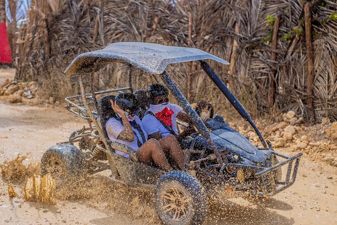 Punta Cana 4 Hours Buggy Tour Cave Macao Beach Free Pick Up - Cueva Taína Cenote: Stairs, Illuminated Stalactites, and Included Swimming