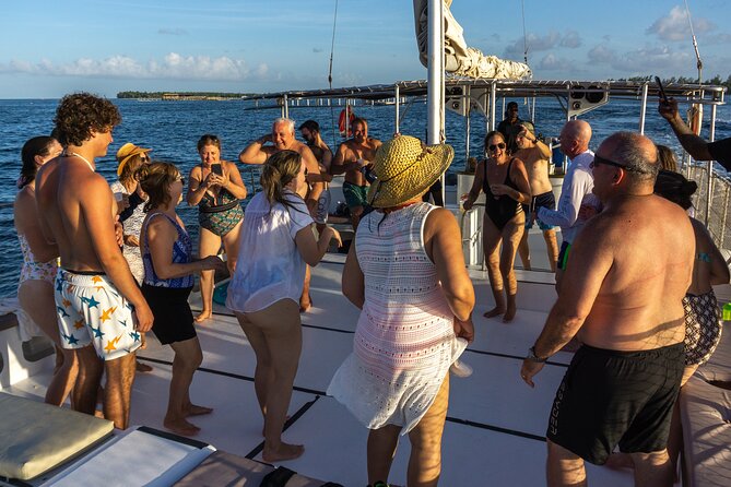 Punta Cana Private Catamaran Cruise: Snorkeling, Beach & BBQ - Open bar, music, and the crew’s role in the vibe