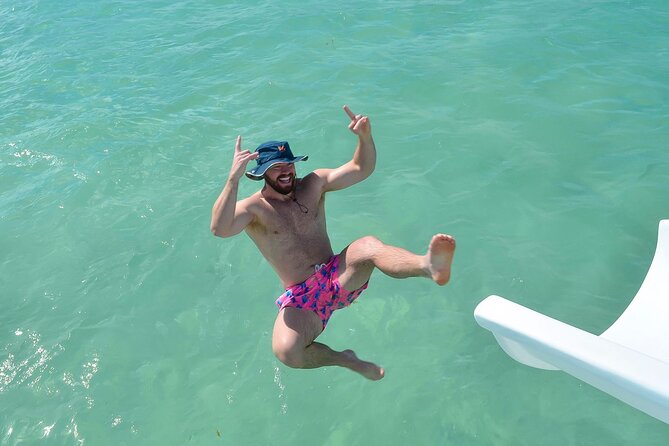 Sand-Bar Punta Cana Party Boat unlimited drinks, snorkeling Vibes - The sandbar swim is the main event: pads, clear water, and the slide
