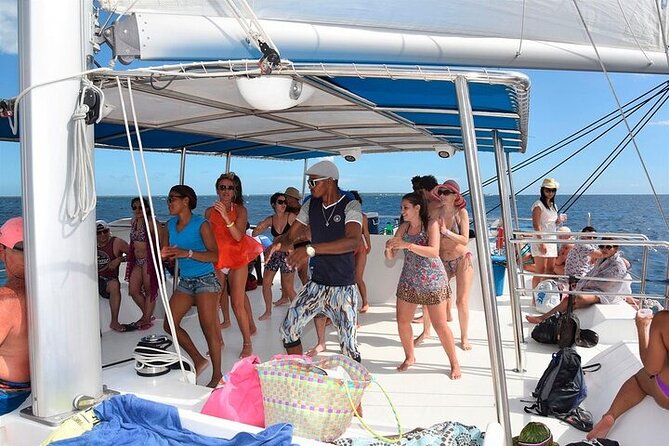 Saona Island from Punta Cana with Transportation and Lunch Included - The catamaran party ride back: snacks, drinks, and dancing